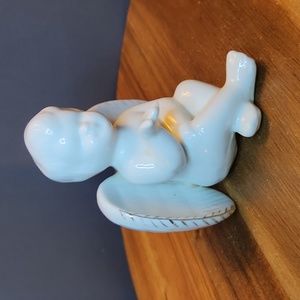 Cherub angel baby in glossy white ceramic.